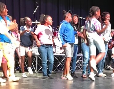 Kids dancing on stage at the Michael Jackson review.