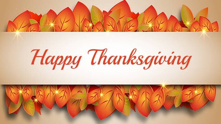 Fall leaves behind a banner with the text Happy Thanksgiving.