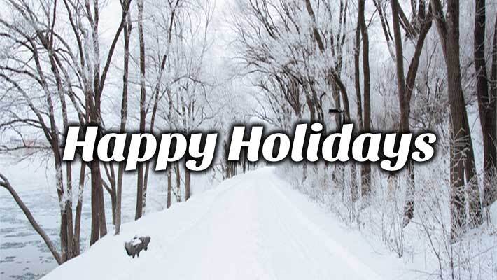 A path in the woods with snow on the ground and the text Happy Holidays.